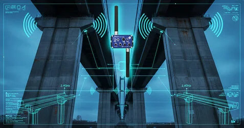 A conceptual visualization of a Wireless Sensor Network (WSN) deployed on a large-scale viaduct. The BeanDevice® 2.4GHz AN-mV is shown at the core of the system, capturing high-precision data from strain gauges and sensors without the need for complex cabling. The technical overlay illustrates the real-time data flow and structural analysis essential for modern Structural Health Monitoring (SHM).